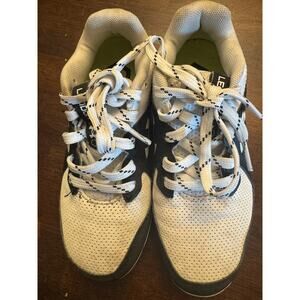 Black and white Under Armour cleats kids size 13 soccer baseball football